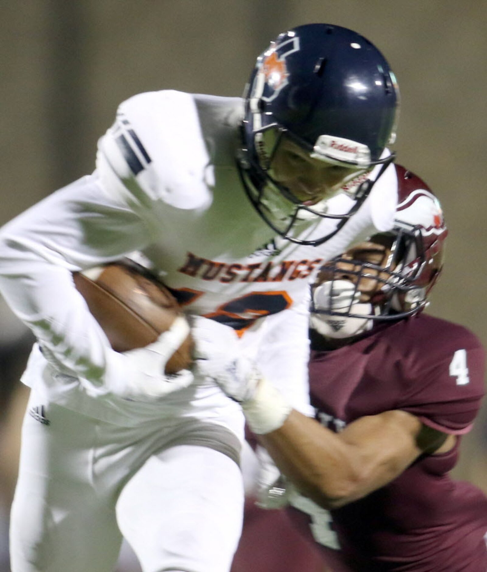 Sachse receiver Nate Shelton (12) is pulled down by Rowlett defensive back Trenton Gordon...