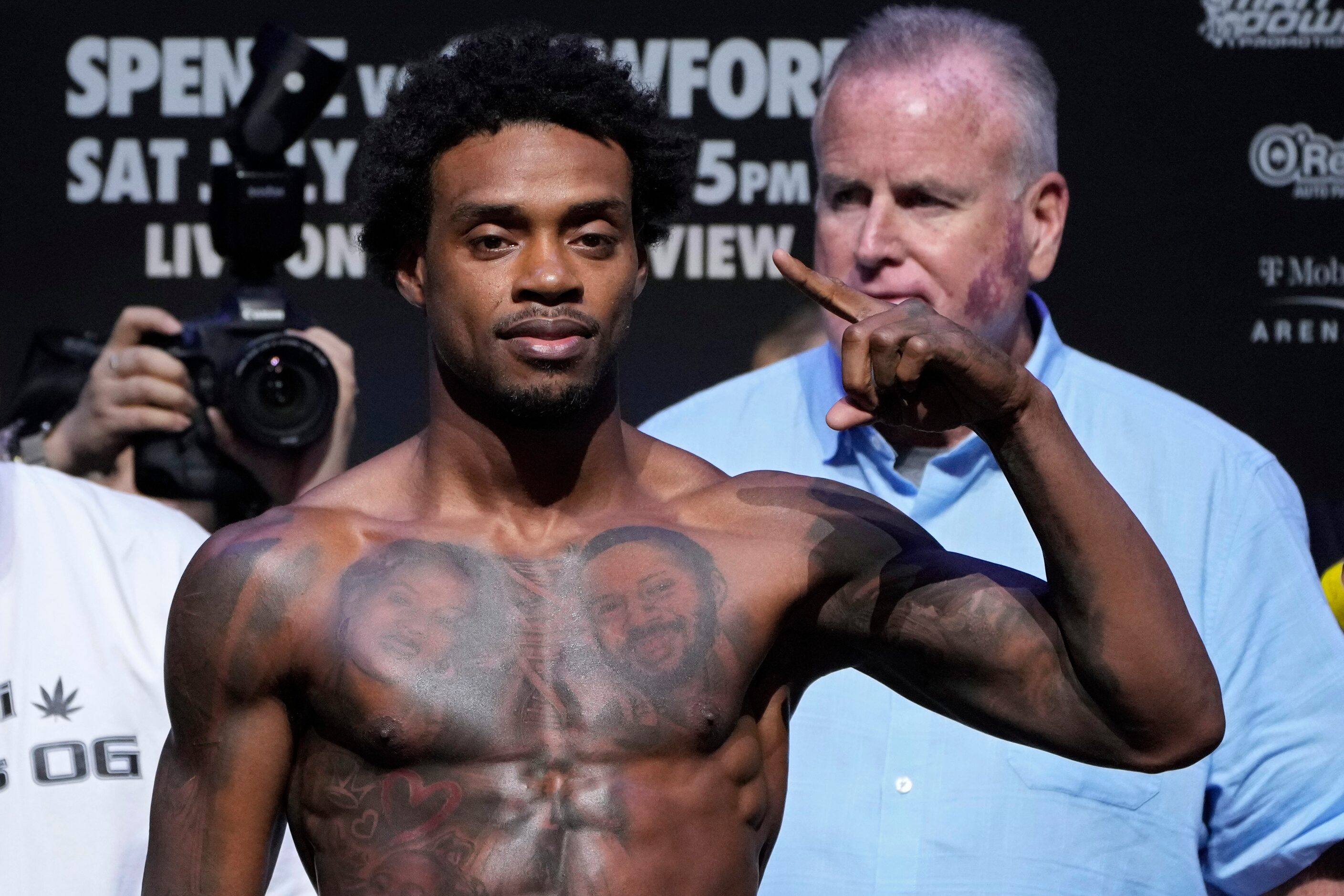 Errol Spence Jr. poses on the scale during a weigh-in Friday, July 28, 2023, in Las Vegas....