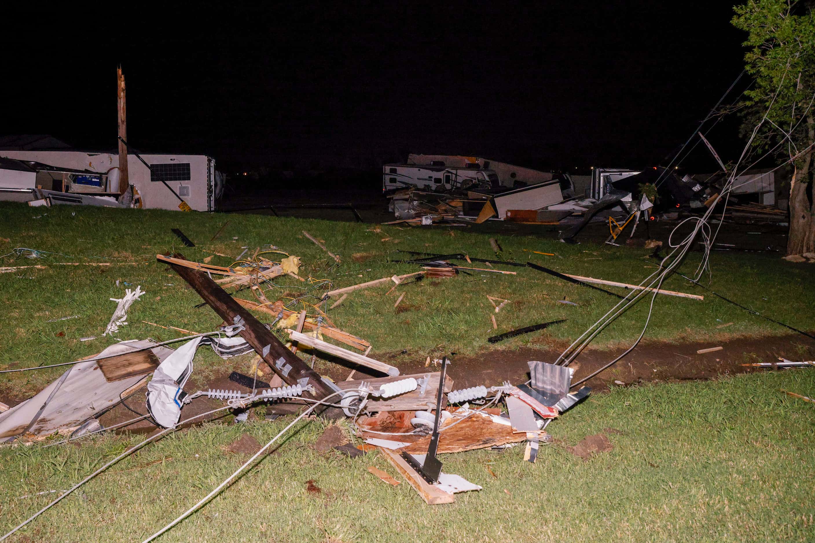 A mangled power line is seen near a recreational vehicle dealership after a suspected...