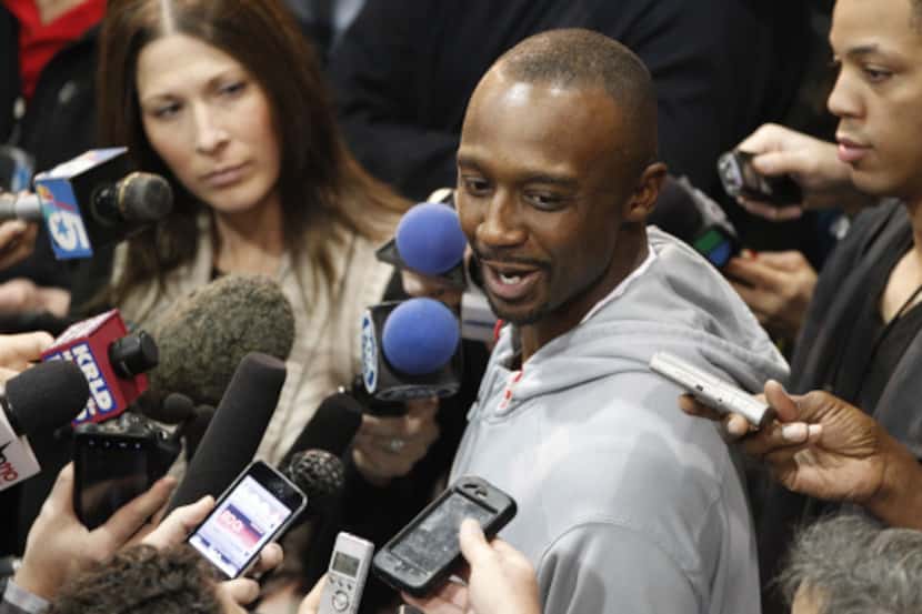 Dallas Mavericks basketball player Jason Terry smiles while speaking to the media at the...