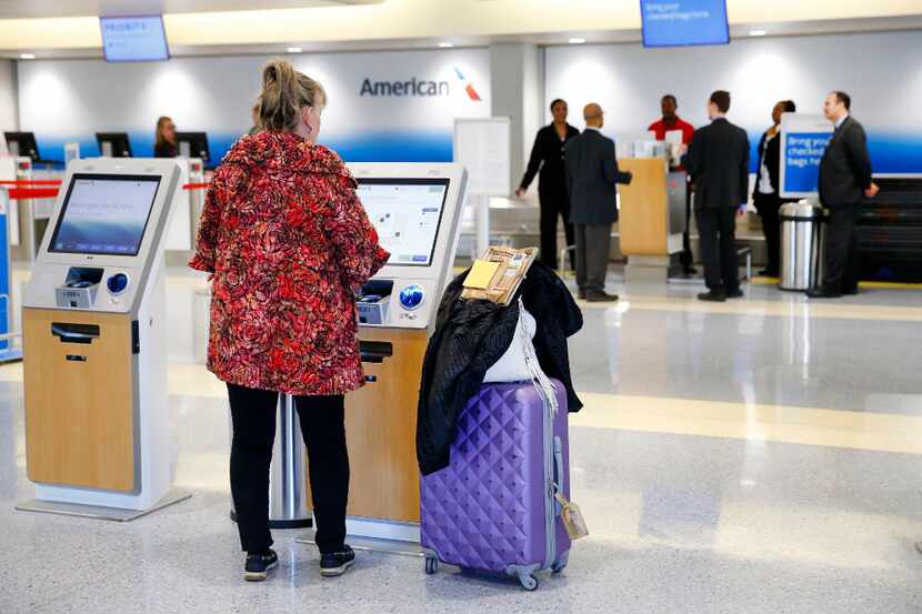 An American Airlines passenger used a kiosk to check in earlier this year at the newly...