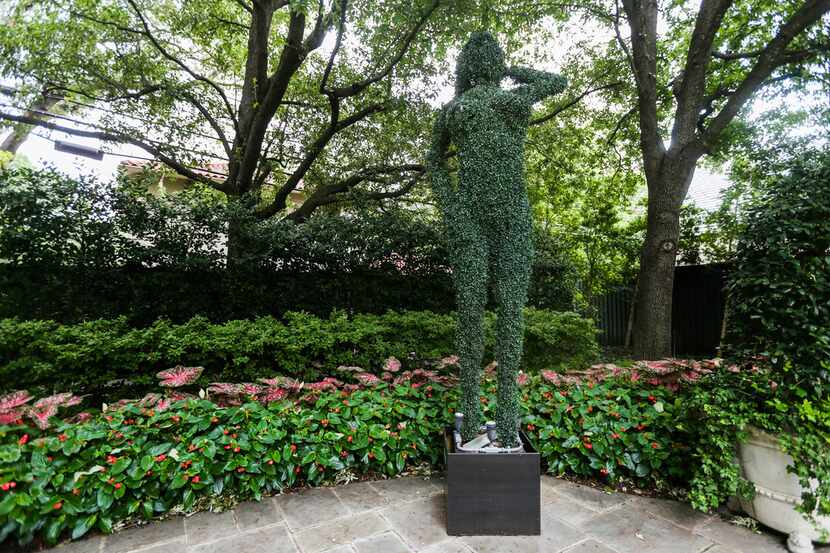 The giant naked-lady fake topiary, a gift from Ross Perot to Linda Pitts Custard, was...