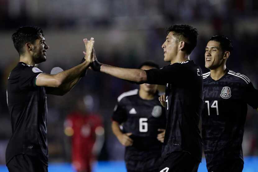 Mexico's Edson Alvarez, second from right, celebrates scoring his side's 2nd goal against...