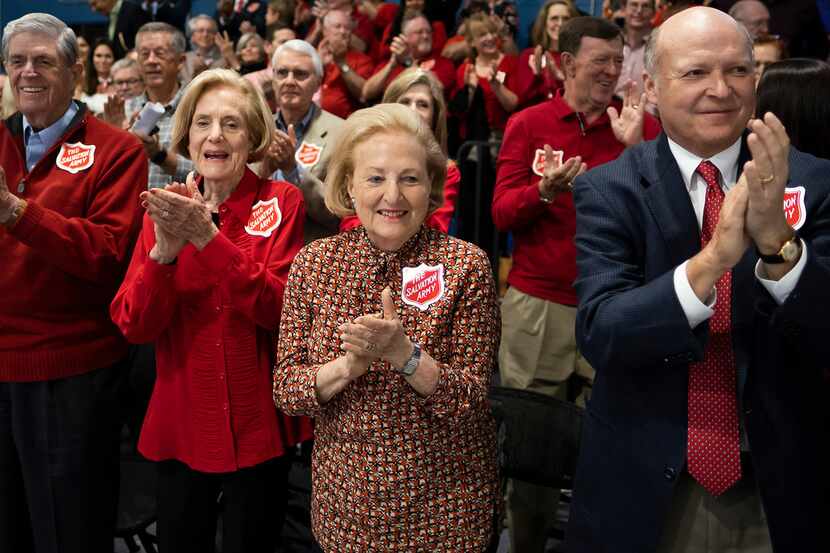 Supporters, including Margot Perot (center) celebrate after the Dallas City Council voted to...