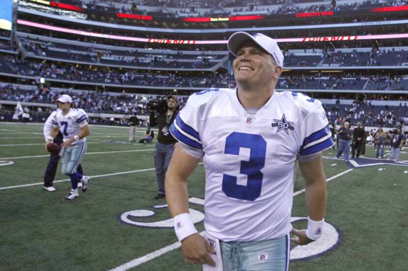 Dallas Cowboys quarterback Jon Kitna smiles at fans after defeating the Washington Redskins...