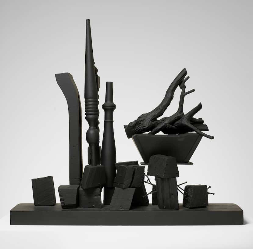 Louise Nevelson's "Night Landscape" is an unsettling spread of blocky wooden forms, upright...