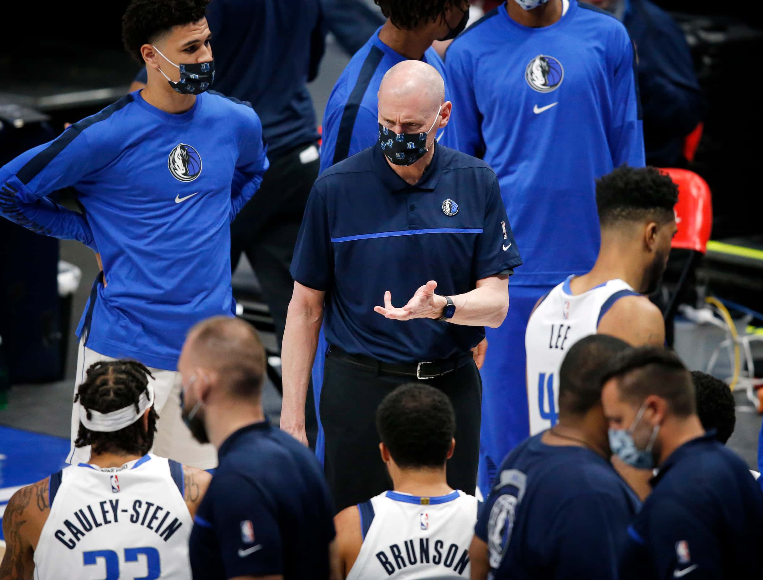 Dallas Mavericks head coach Rick Carlisle visits with his players in the fourth quarter of...