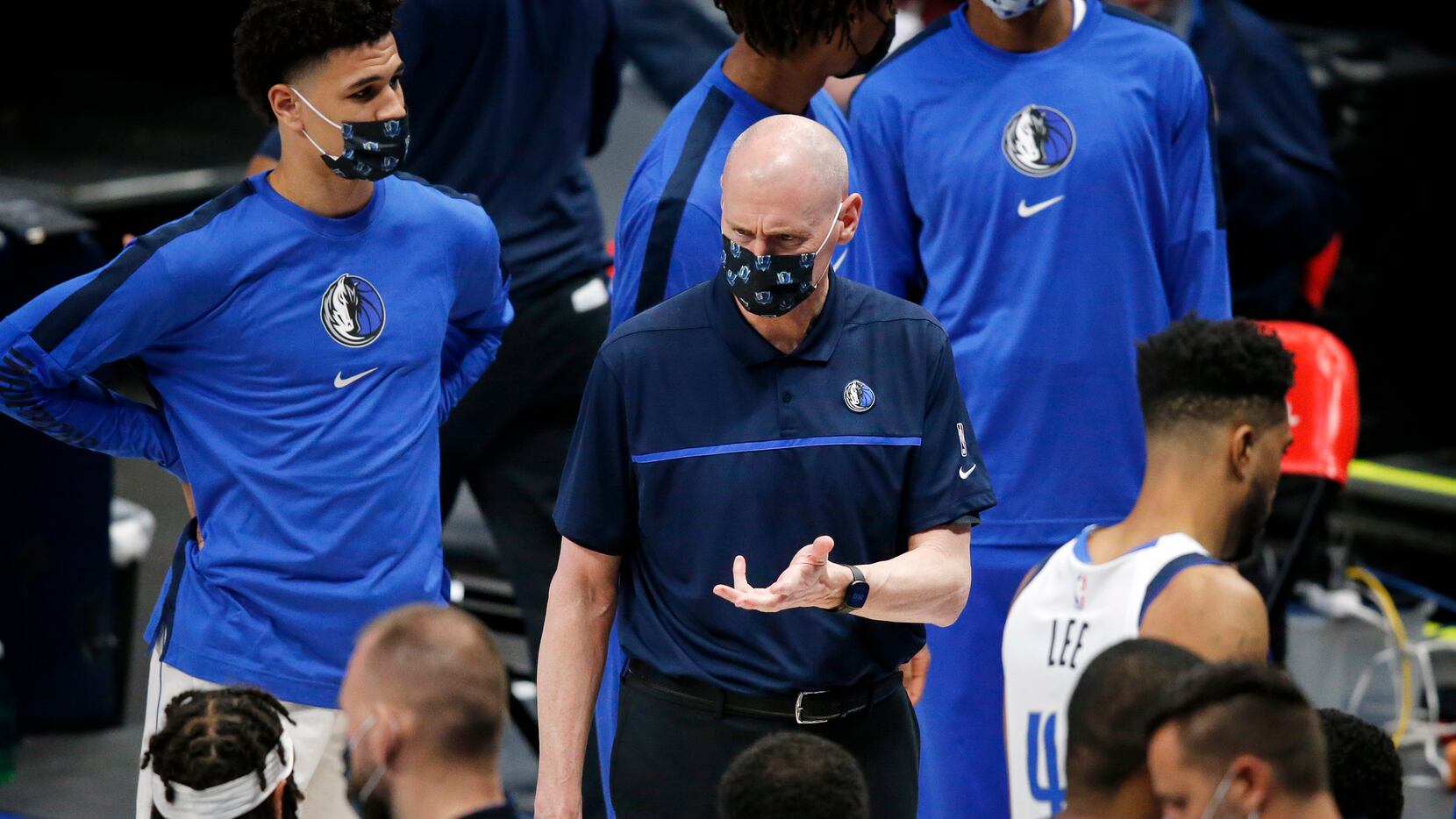 Dallas Mavericks head coach Rick Carlisle visits with his players in the fourth quarter of...