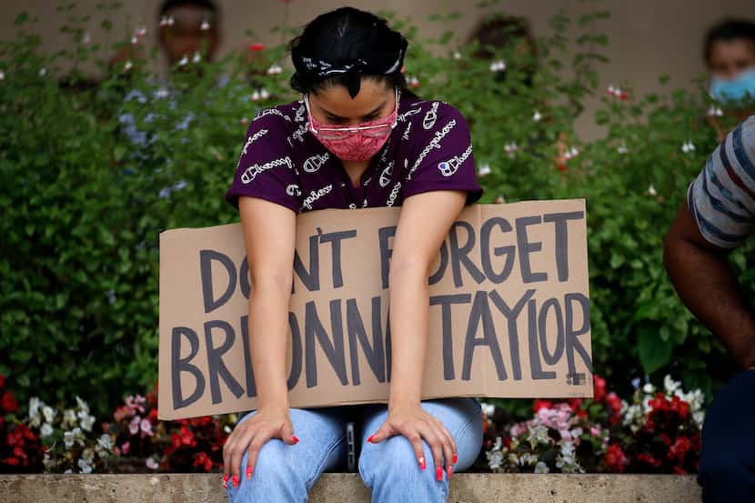 A protester supporting Breonna Taylor, the Kentucky woman fatally shot by police in March,...