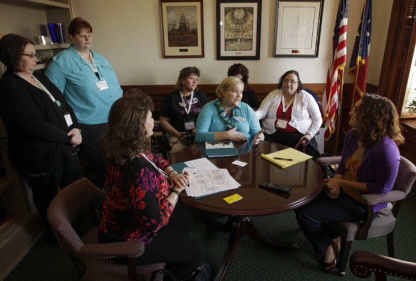 Texas Classroom Teachers Association representative Twila Read (center) of Arlington and...