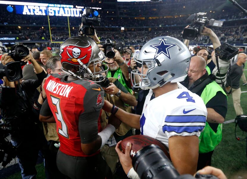 Tampa Bay Buccaneers' Jameis Winston (3) and Dallas Cowboys' Dak Prescott (4) greet each...