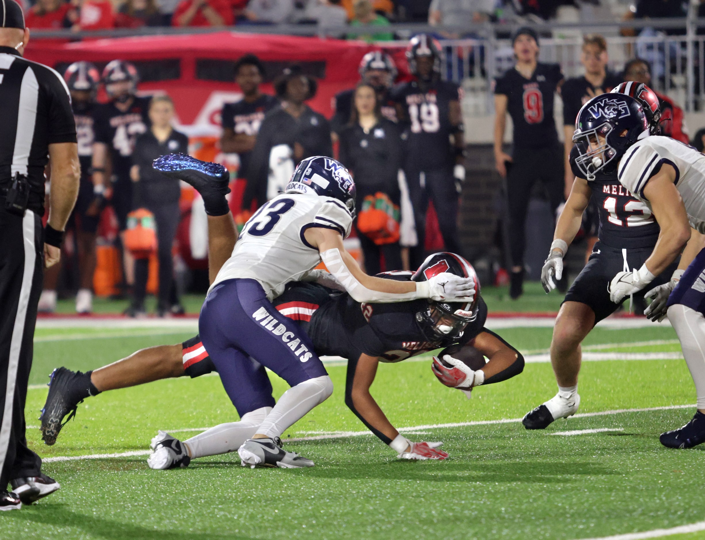 Melissa player #22 Jeremiah Tabor dives to gain an extra yard during the Prosper Walnut...