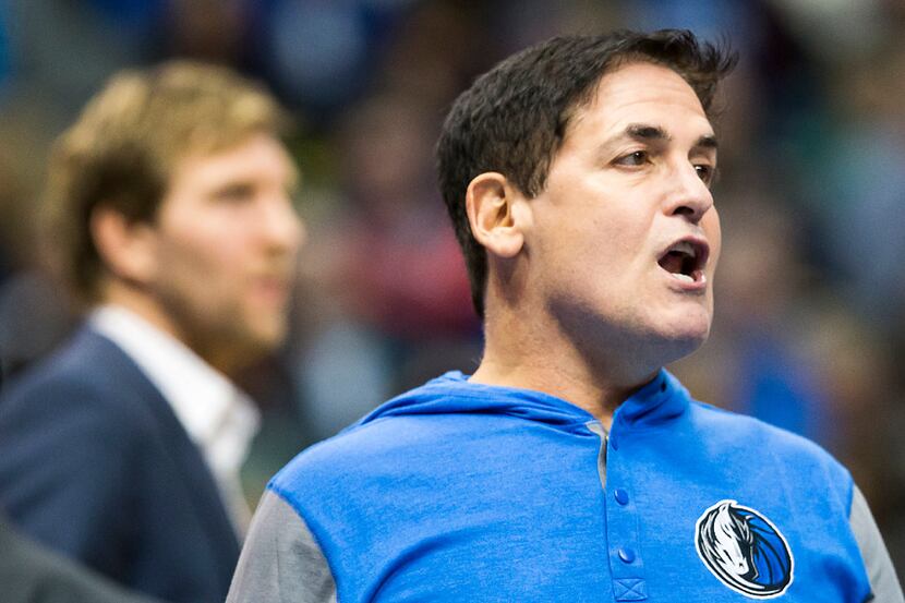 FILE - Mavericks owner Mark Cuban yells toward the referees during the first half of a game...