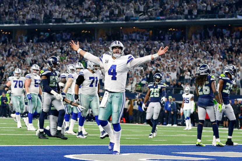 Dallas Cowboys quarterback Dak Prescott (4) celebrates after what what he thought was a...