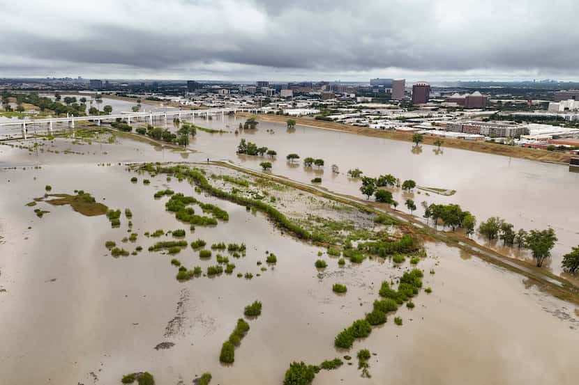 An aerial view of a swollen Trinity River looking Northwest in Dallas, August 22, 2022.