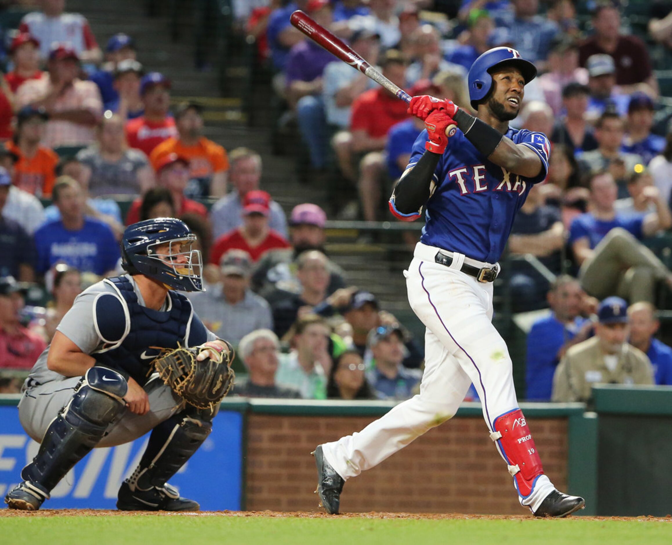 Texas Rangers shortstop Jurickson Profar (19) hits a home run to make the score 1-5 during...