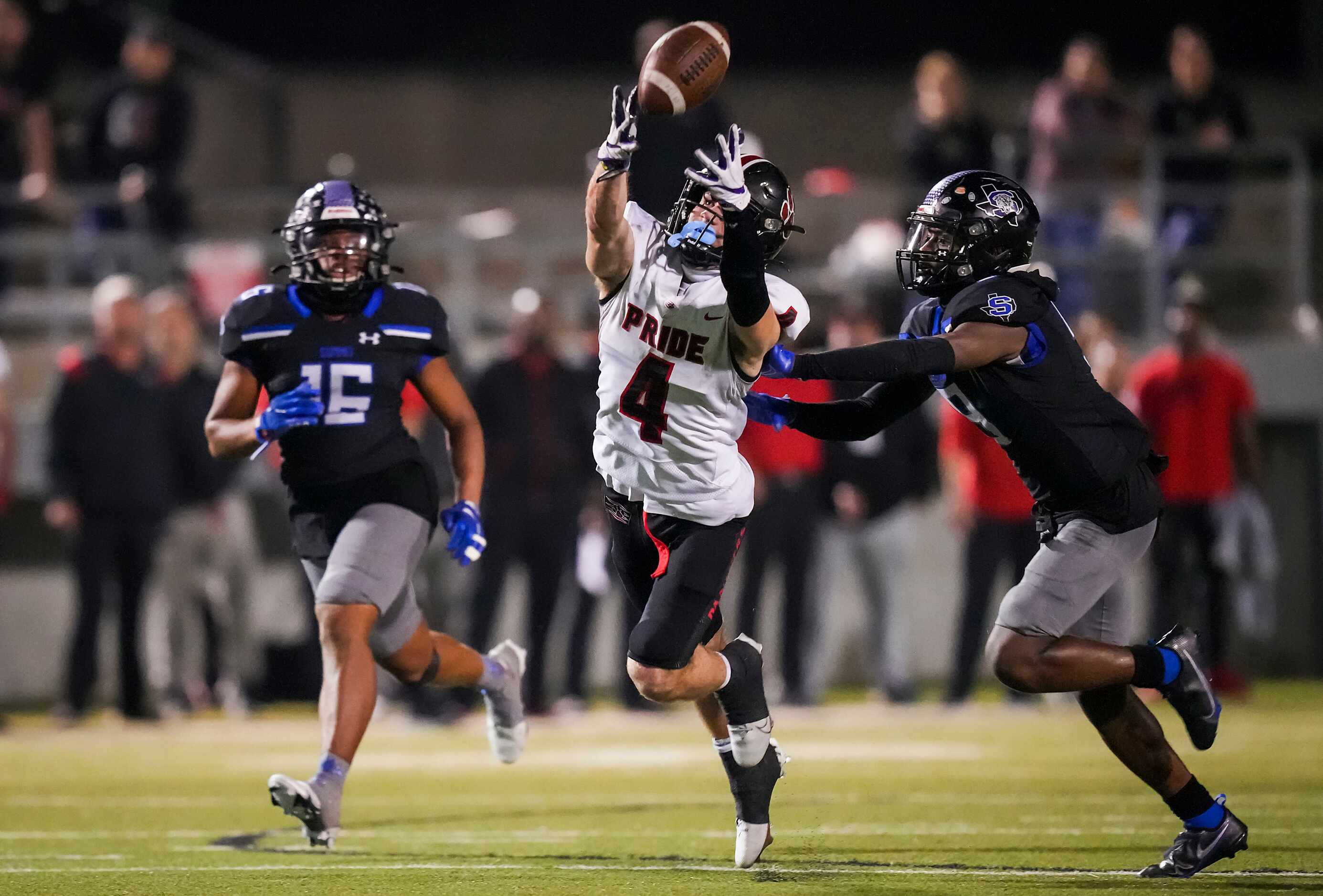 Colleyville Heritage wide receiver Hogan Wasson (4) has a pass go off his hands as Mansfield...