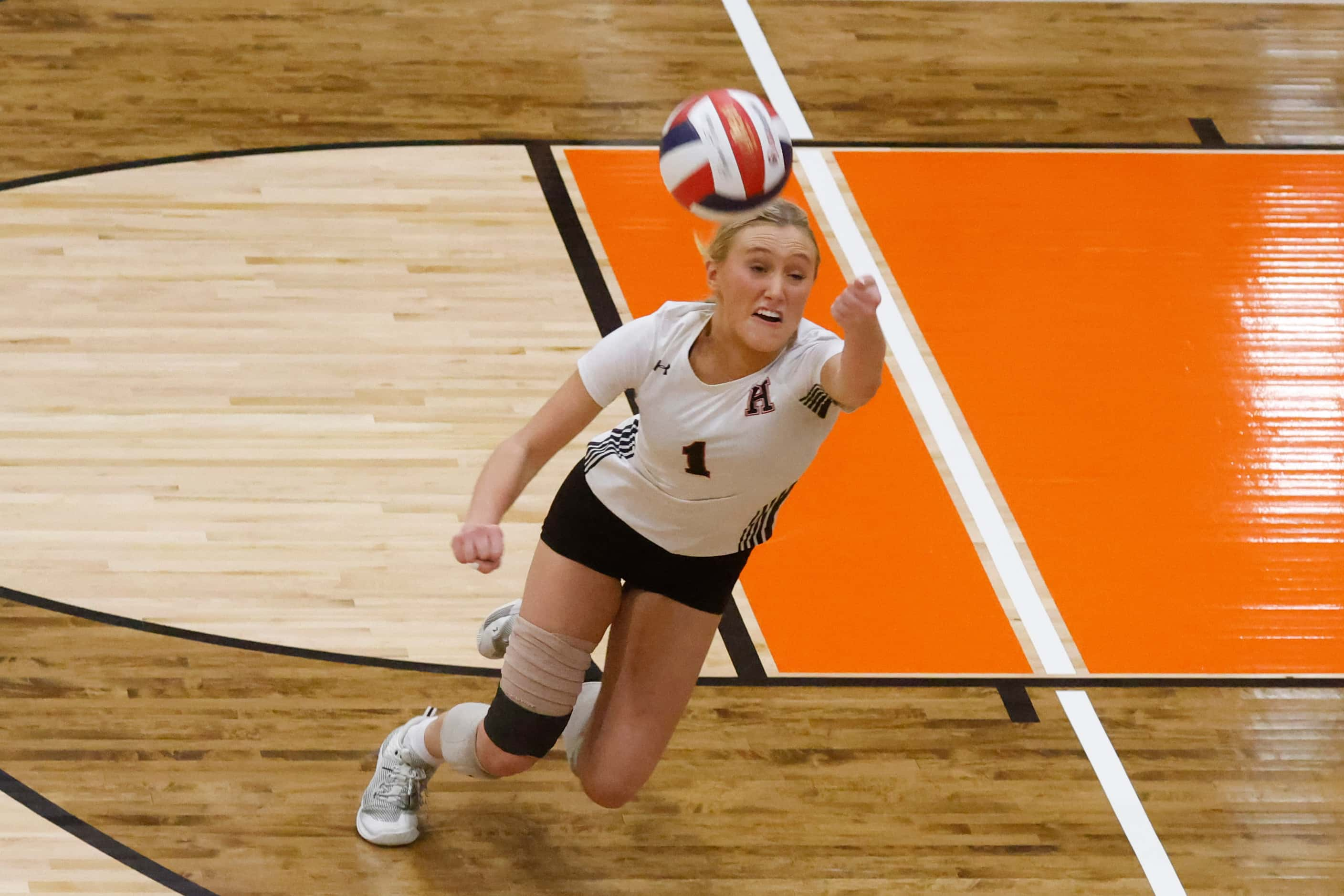 Rockwall Heath’s Reagan Ruecker dives to save a point during a volleyball game against...