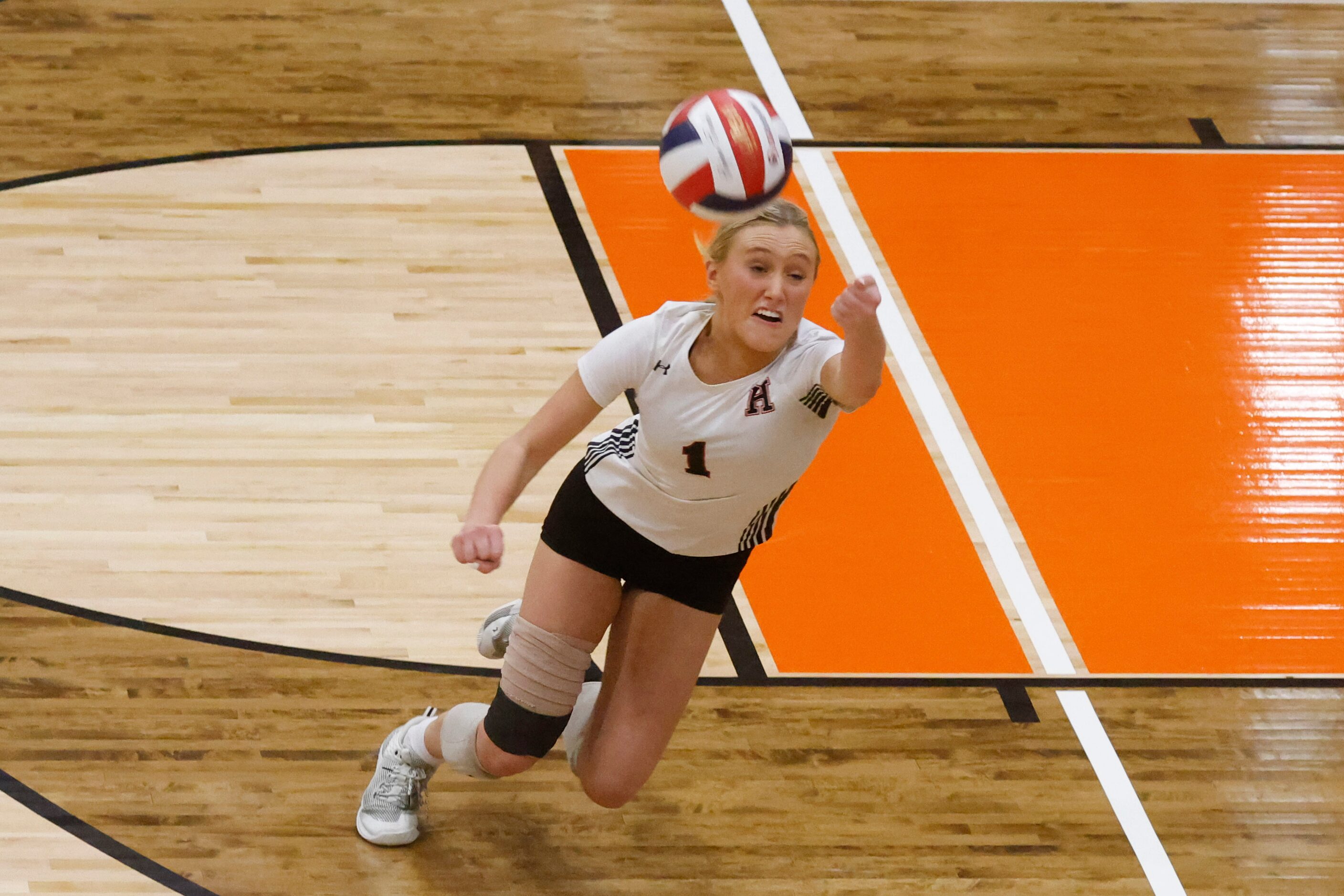 Rockwall Heath’s Reagan Ruecker dives to save a point during a volleyball game against...