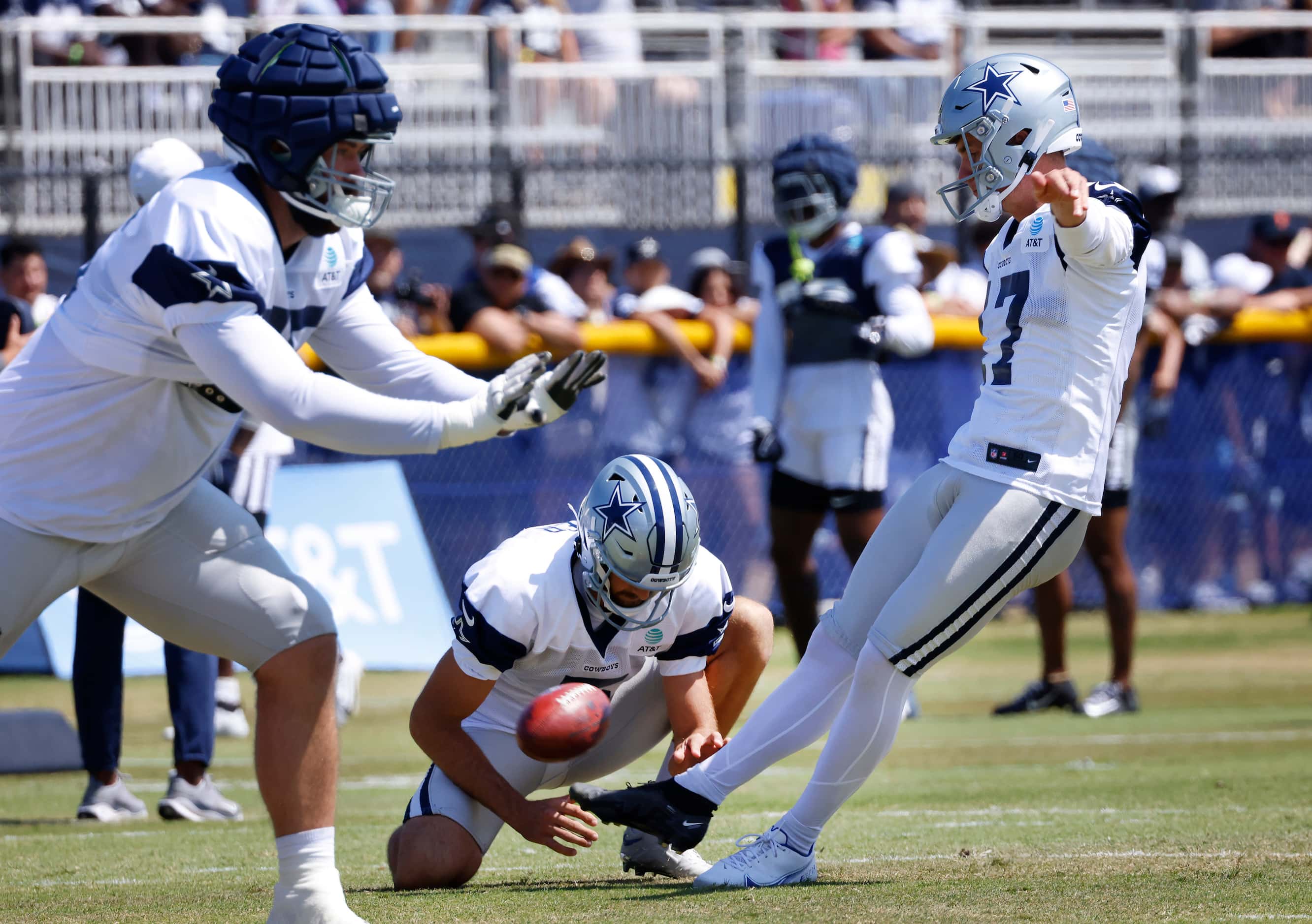 Dallas Cowboys place kicker Brandon Aubrey (17) kicks a field goal as Bryan Anger holds the...
