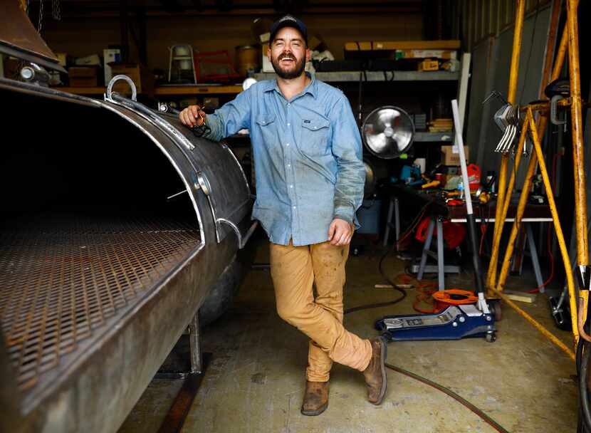 Guess Family Barbecue owner and pitmaster Reid Guess takes a break from welding on a...