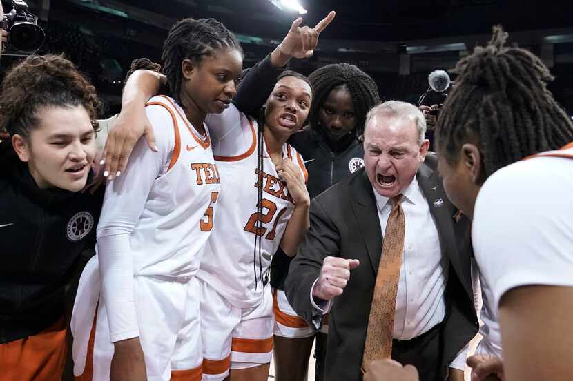 FILE - Texas head coach Vic Schaefer reacts as he huddles with his team after a college...
