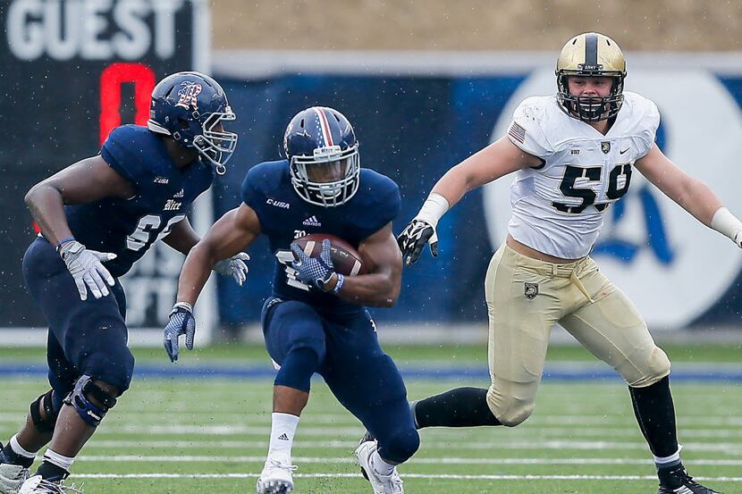 HOUSTON, TX - OCTOBER 24:  Samuel Stewart #24 of the Rice Owls rushes up the middle past...