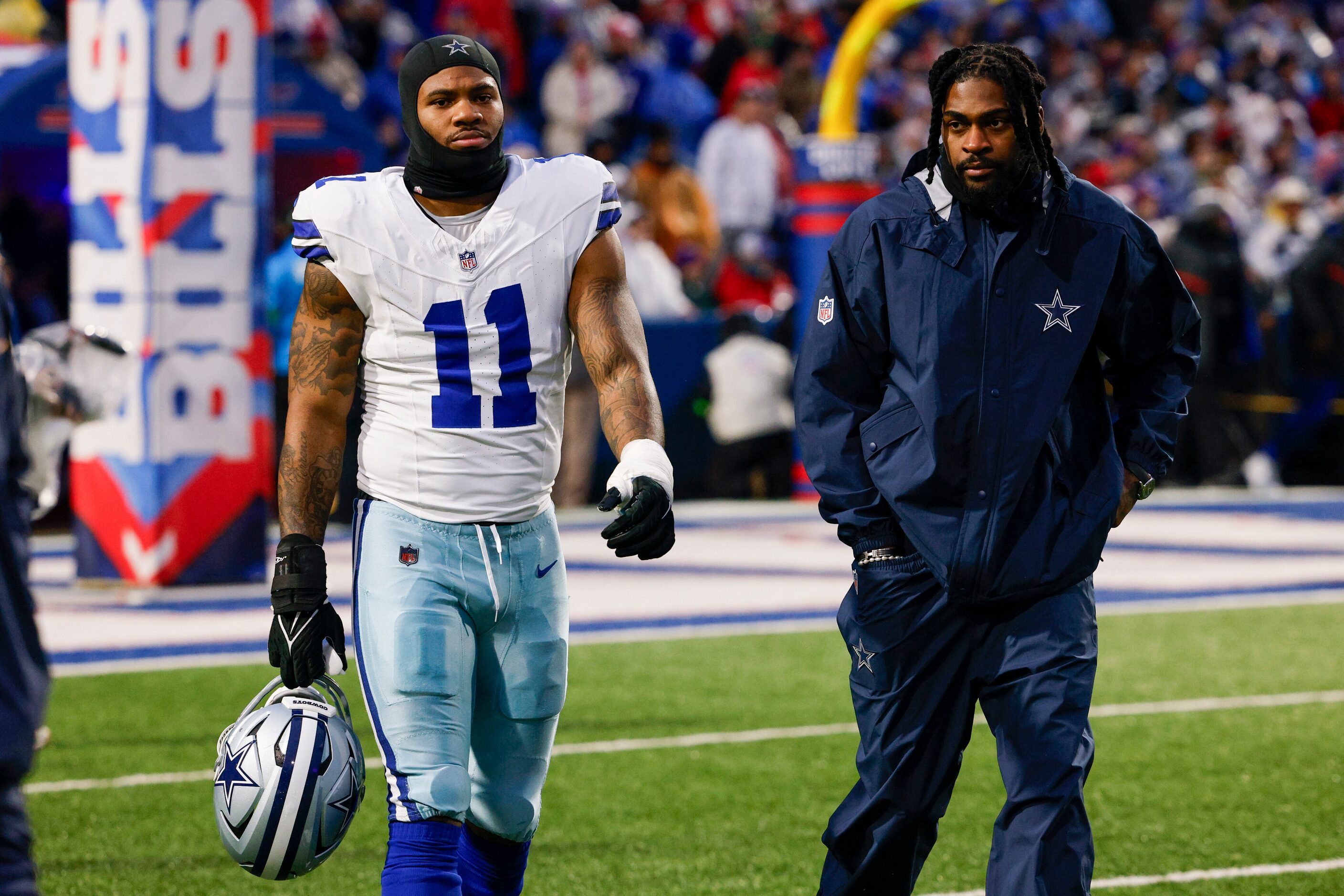 Dallas Cowboys linebacker Micah Parsons (11) walks on to the field alongside cornerback...