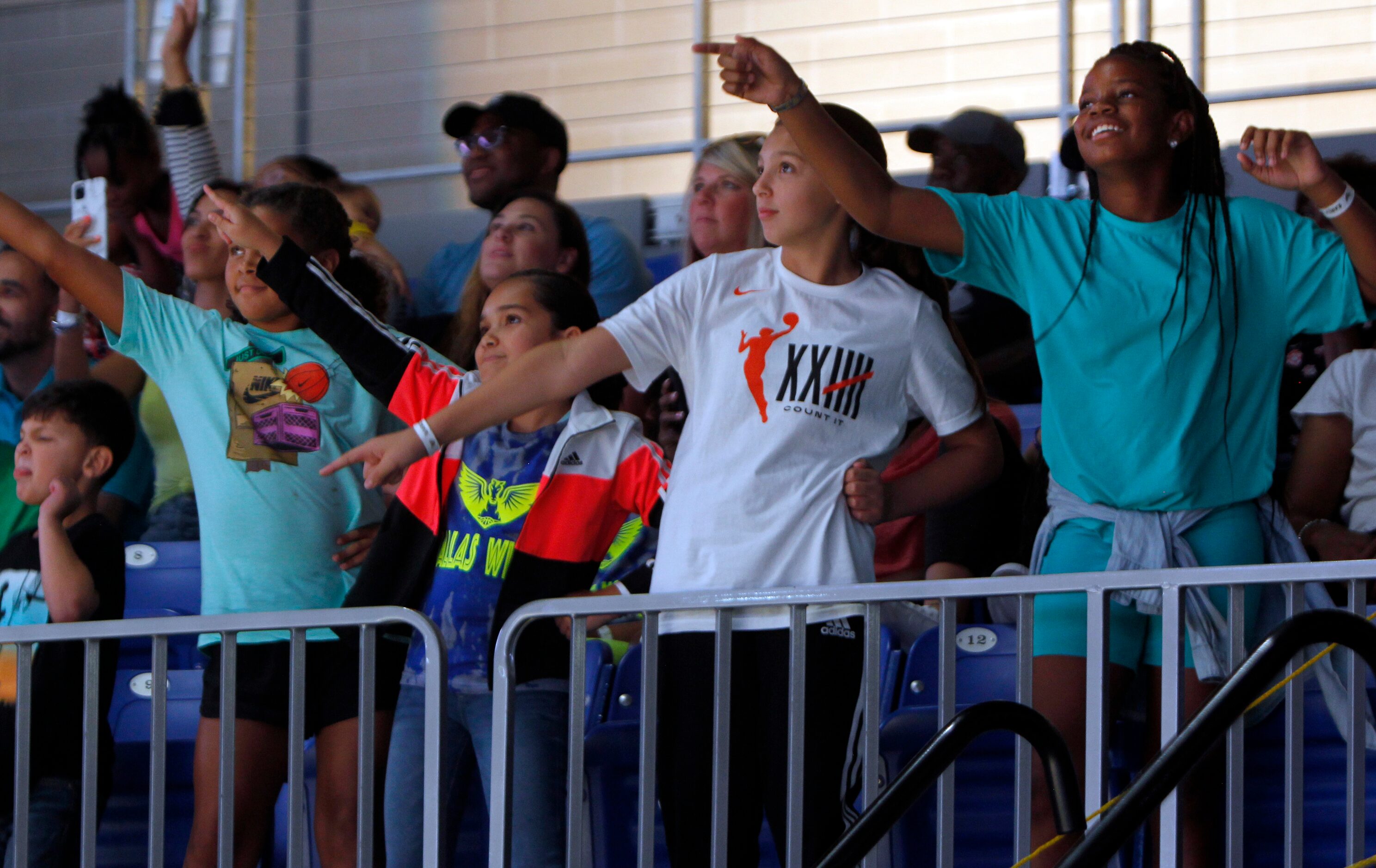 Young Wings fans display their dance moves for a chance to be seen on the scoreboard screen...