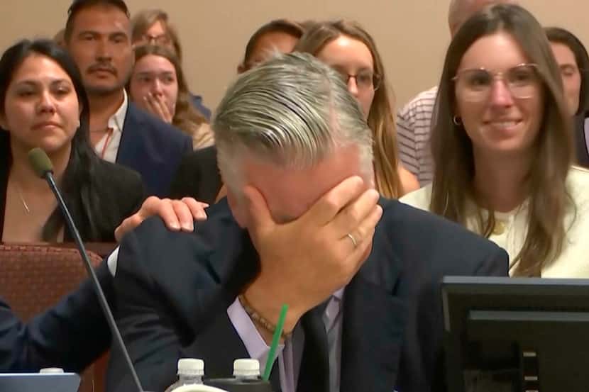 Actor Alec Baldwin reacts after the judge threw out the involuntary manslaughter case for...