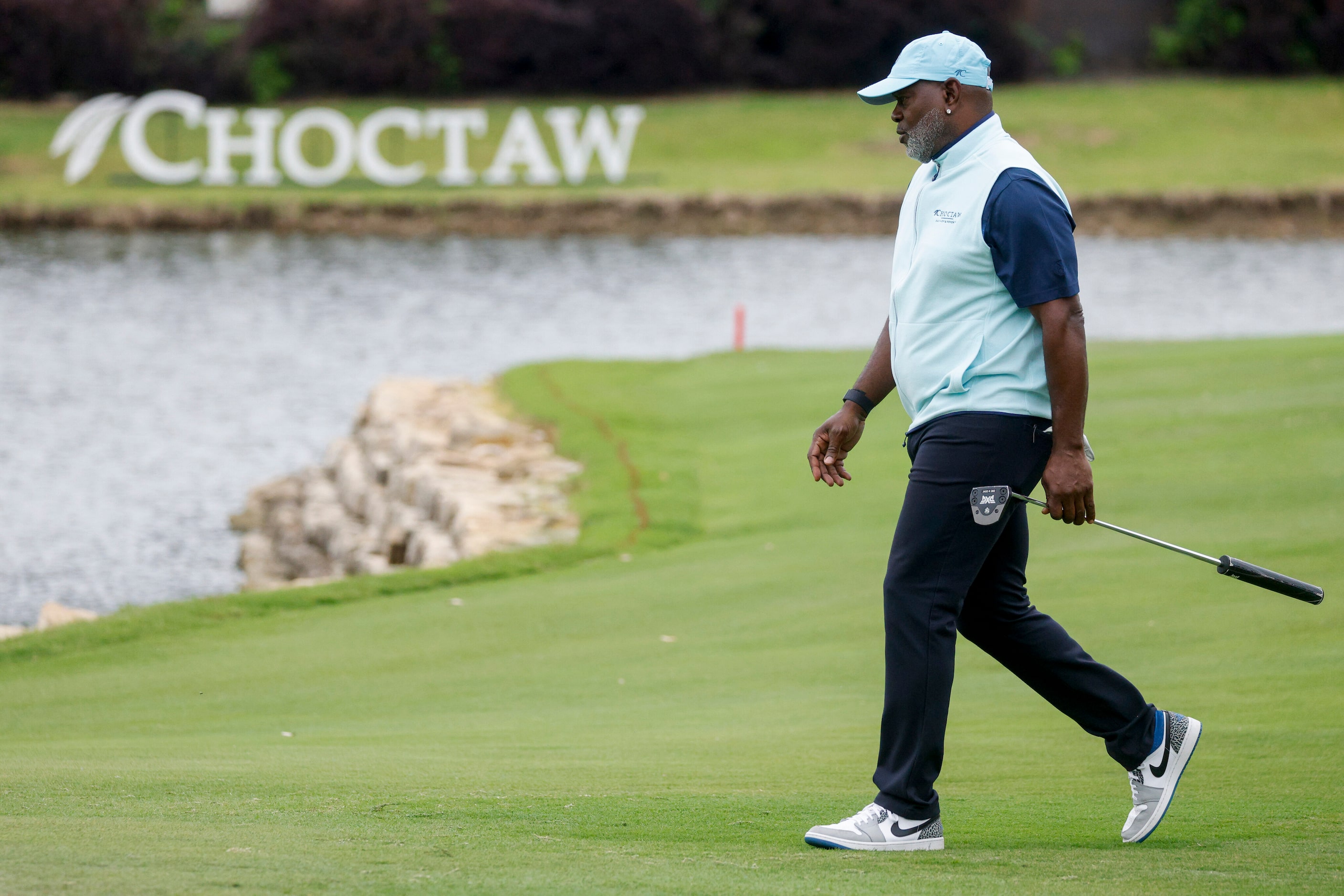 Former Dallas Cowboys running back Emmitt Smith walks to the 18th green during the first...