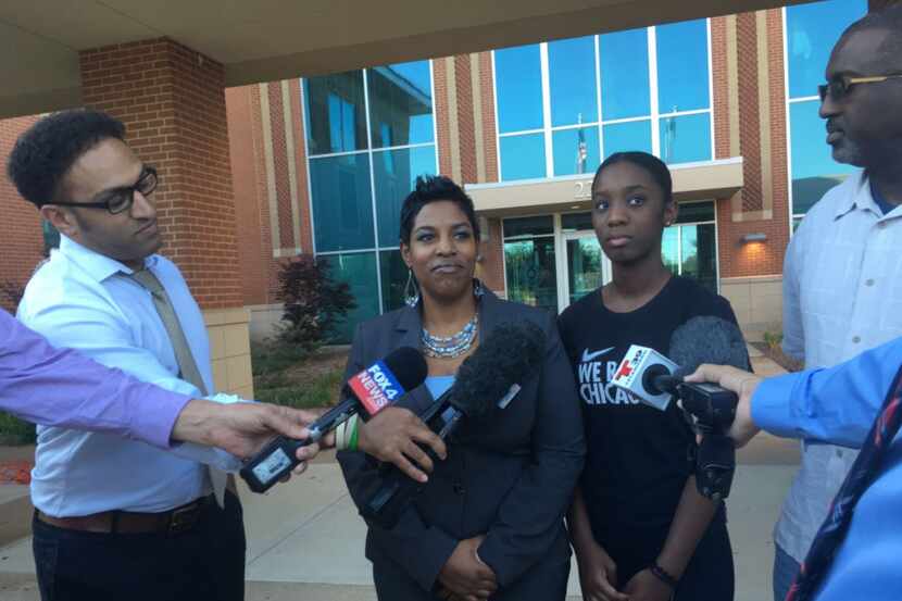 Dajerria Becton (right center) and her attorney, Kim T. Cole, at a news conference June 6 at...