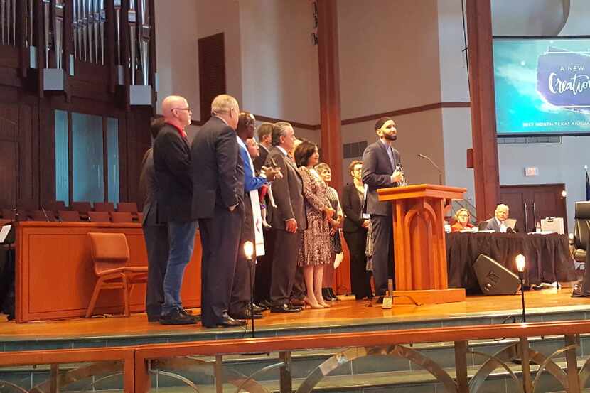 Imam Omar Suleiman accepts the Bishop Oden Award from the North Texas Conference of the...