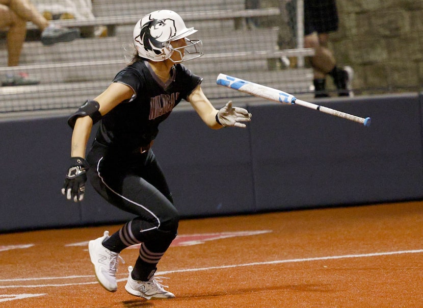 Denton Guyer's Kaylynn Jones (6) throws a bat after hitting a single during the fifth inning...