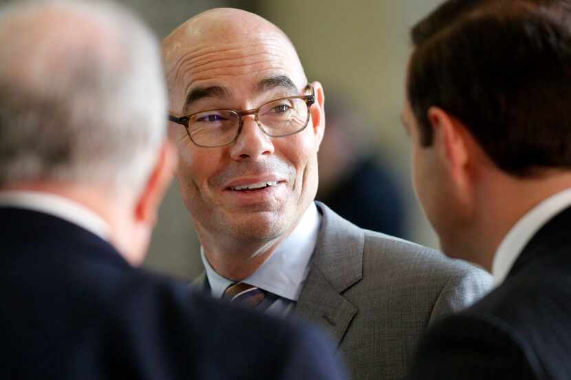 Texas Speaker of the House Honorable Dennis Bonnen (center) visits with colleagues during...