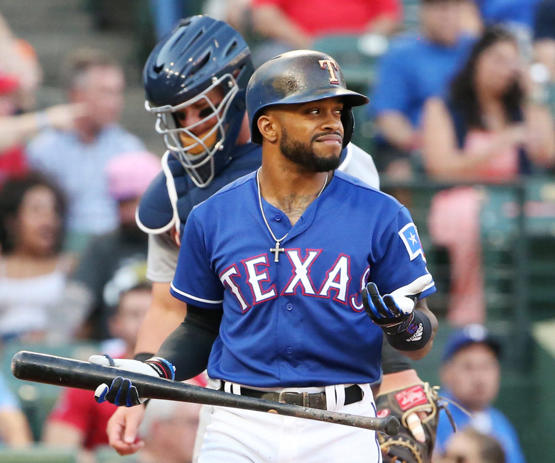 Texas Rangers left fielder Delino DeShields (3) reacts after being called out on strikes...