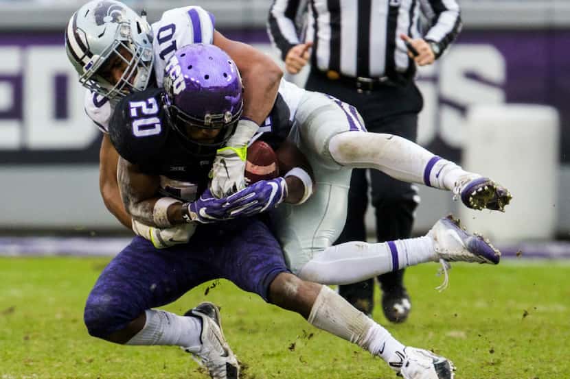 TCU Horned Frogs wide receiver Deante Gray (20) is tackled by Kansas State Wildcats...