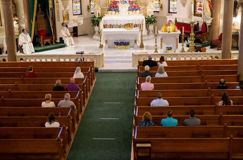 Bishop Michael Olson (top right) delivers his homily during mass in 2020.