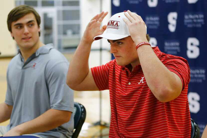 Fort Worth All Saints' Episcopal School James Brockermeyer adjusts his Alabama hat after...