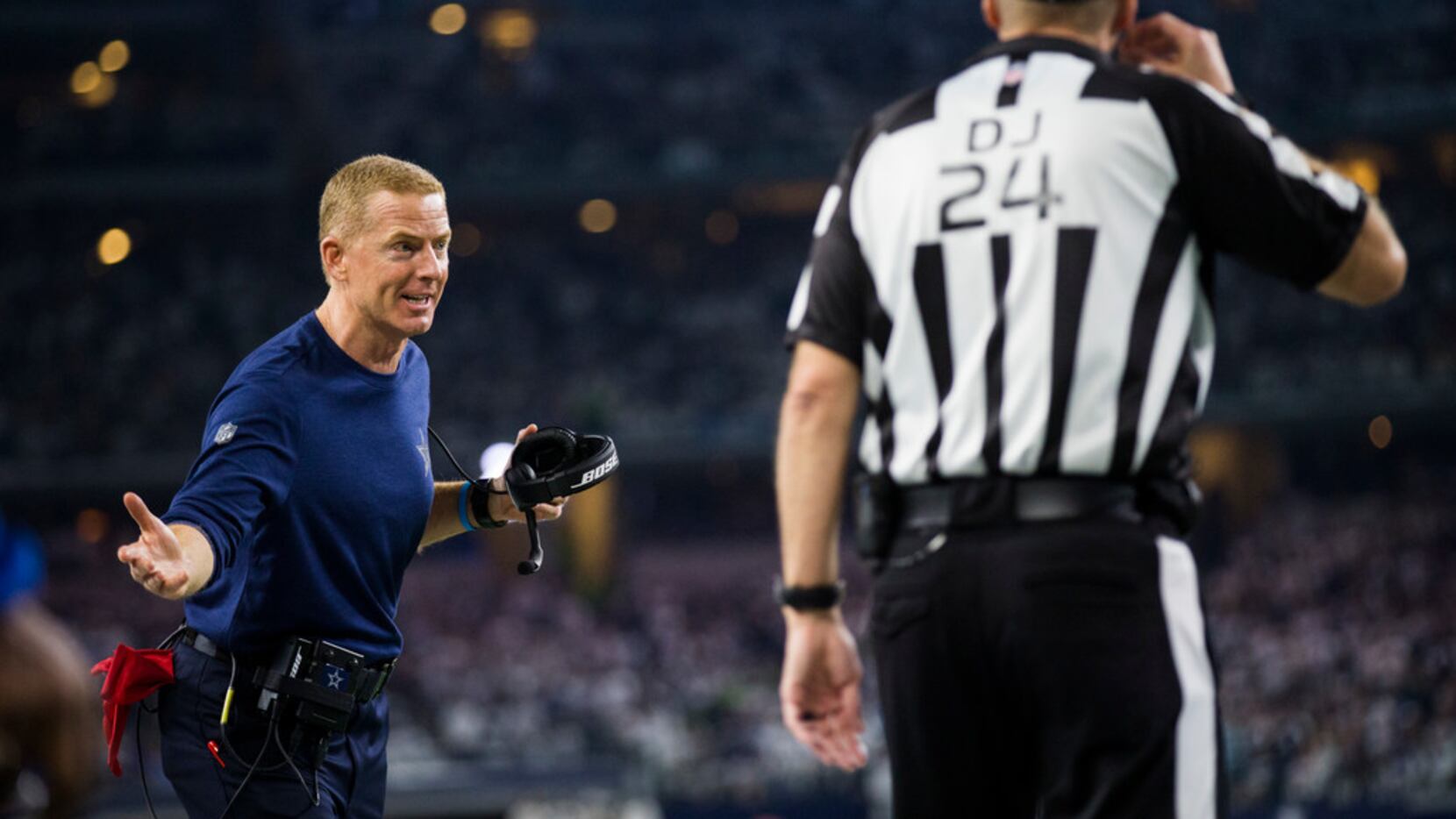 Dallas Cowboys head coach Jason Garrett disputes a call during the fourth quarter of an NFL...