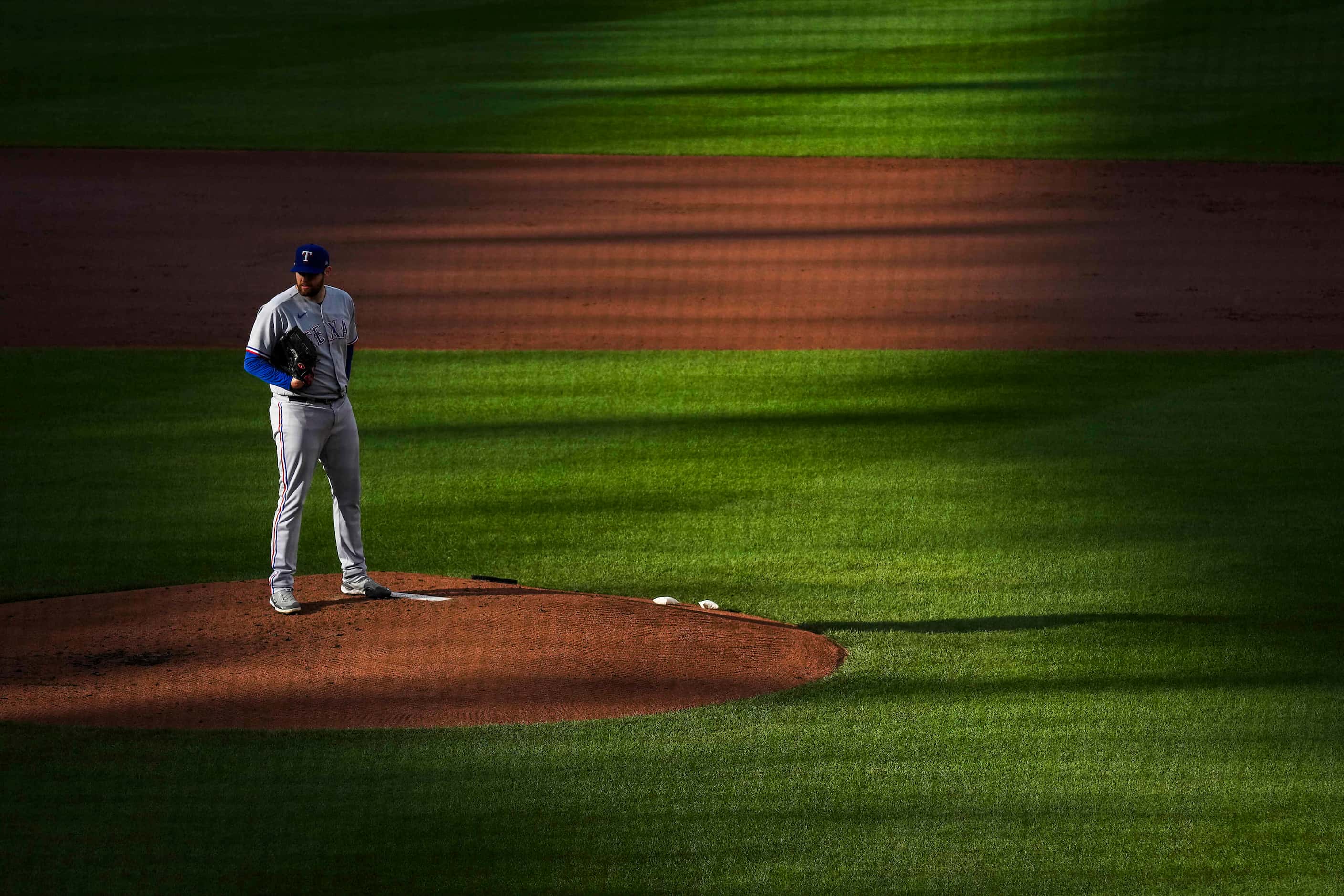 Texas Rangers starting pitcher Jordan Montgomery looks in for a sign during the first inning...