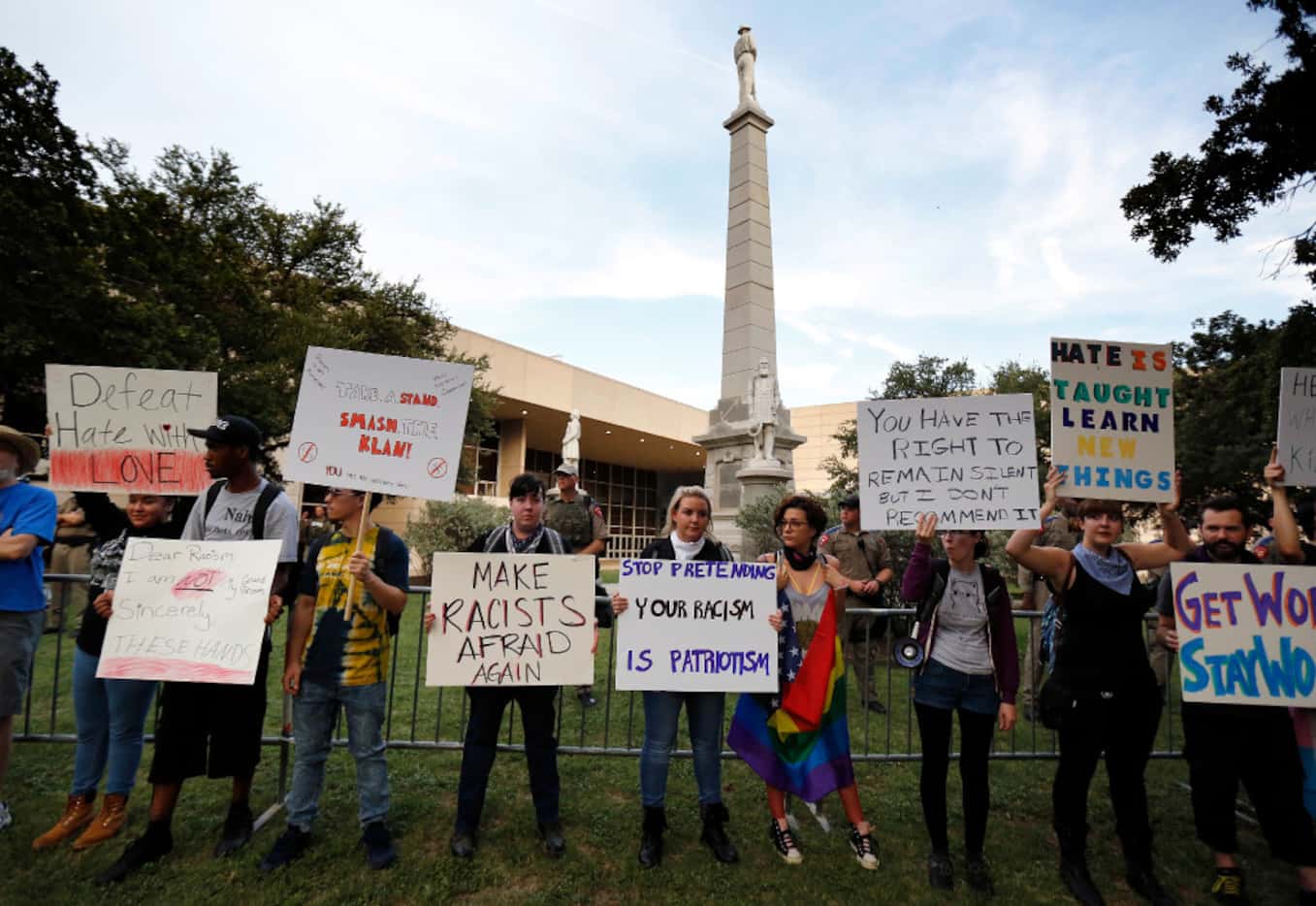 Protesters lined the fence surrounding the Confederate War Memorial in Pioneer Park chanting...