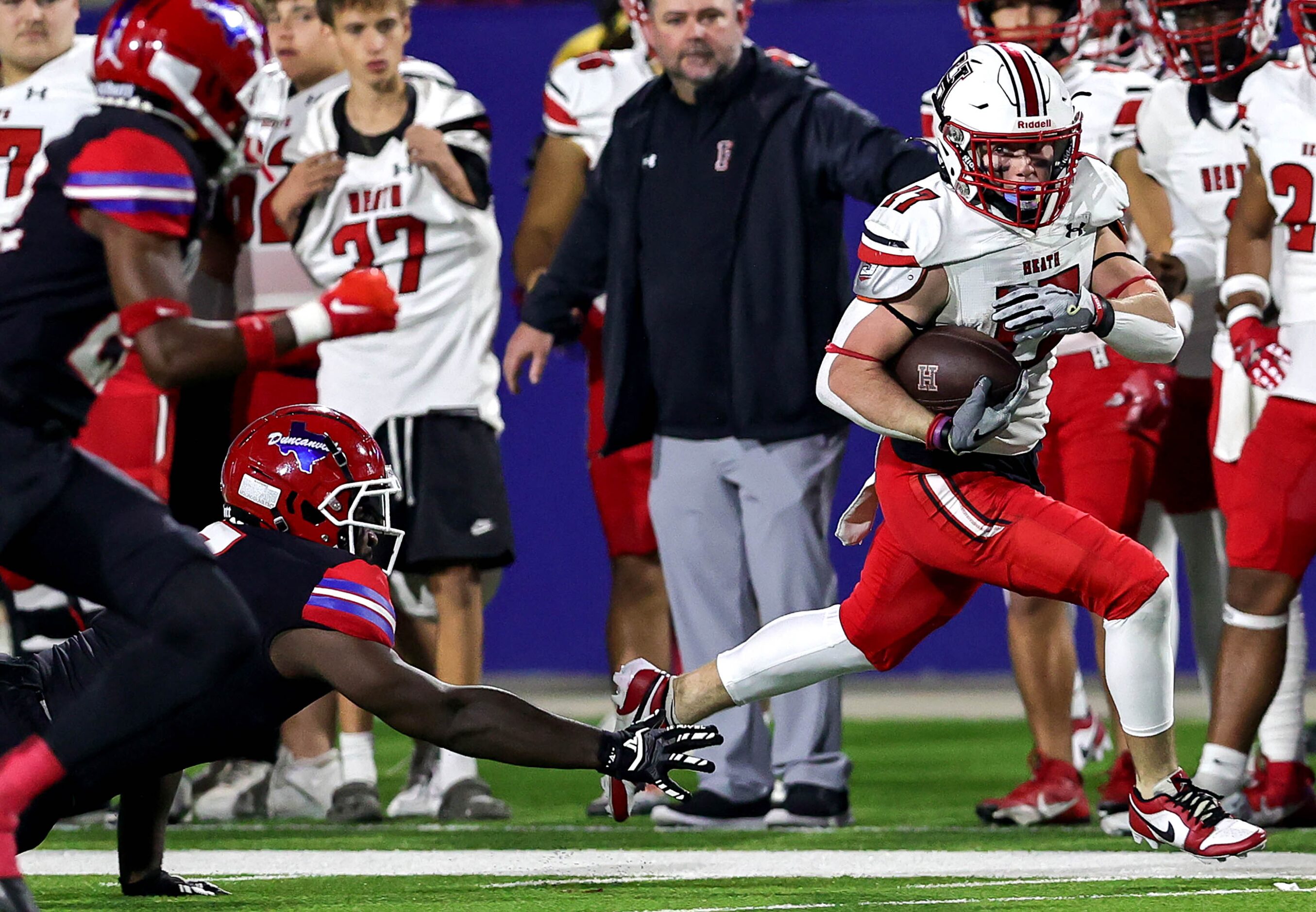 Rockwall Heath wide receiver Jack Davenport (17) runs down the sideline after making a...