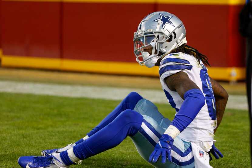 Dallas Cowboys wide receiver CeeDee Lamb (88) sits in the end zone after an interception...