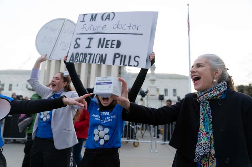 Abortion-rights activists rally outside of the Supreme Court, Tuesday, March 26, 2024, in...