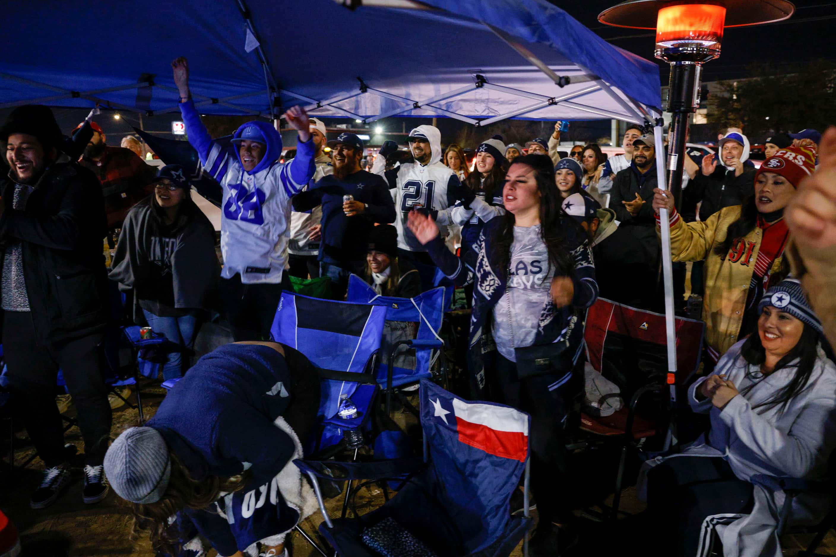Fans react during the Dallas Cowboys final drive during the fourth quarter of an NFL...