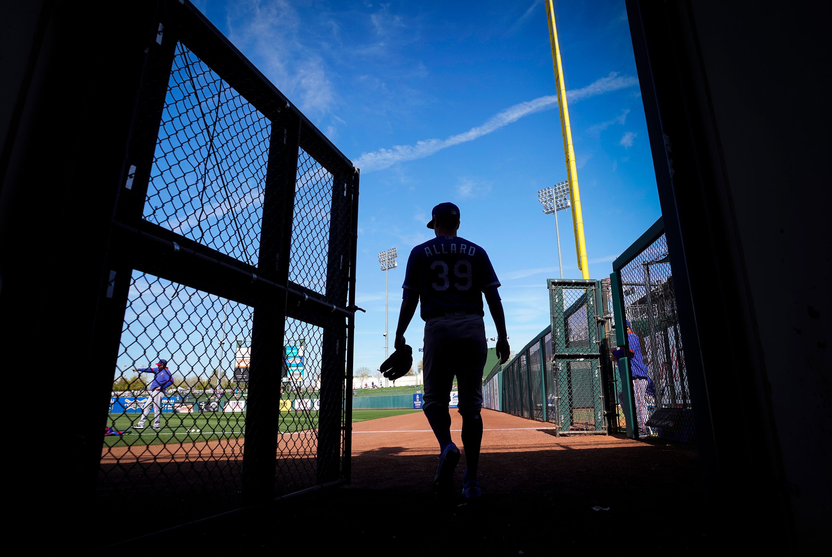 Texas Rangers starting pitcher Kolby Allard walks from the tunnel onto the field for the...