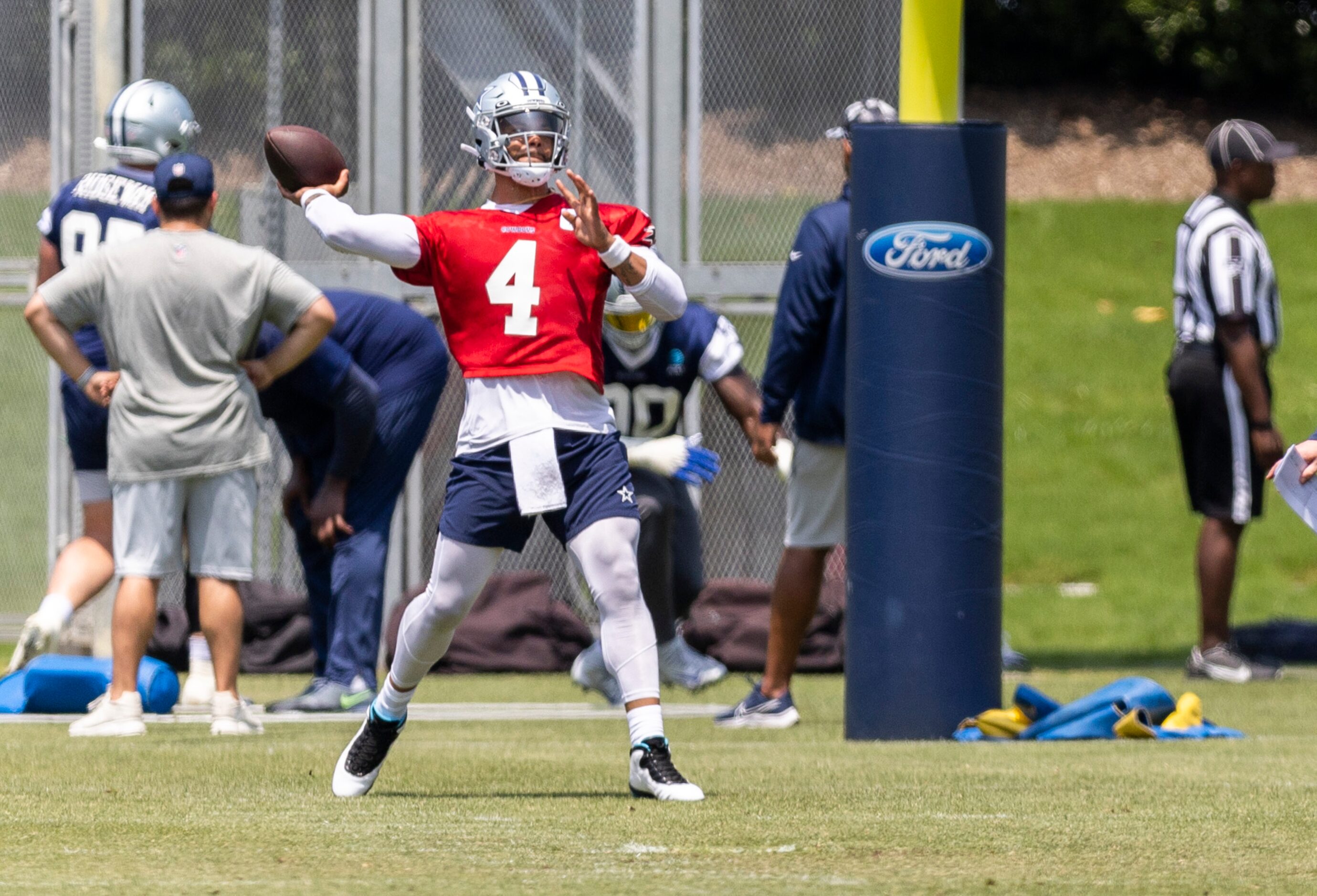 Dallas Cowboys quarterback Dak Prescott throws during practice at The Star in Frisco,...