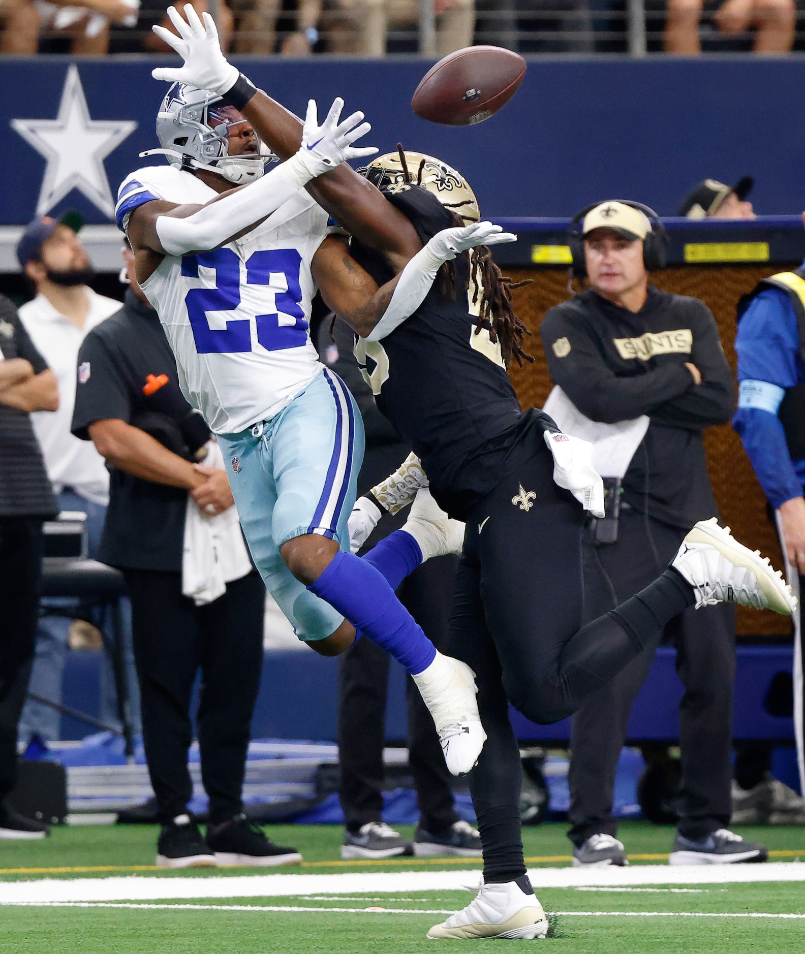 New Orleans Saints linebacker Demario Davis (56) gets a hand in the face of Dallas Cowboys...