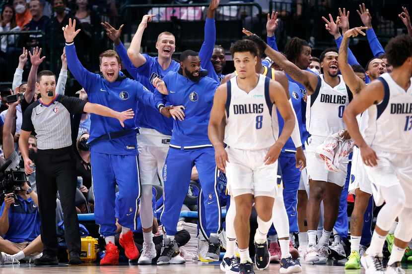 (from left) The Dallas Mavericks bench including (from left) guard Luka Doncic, center...